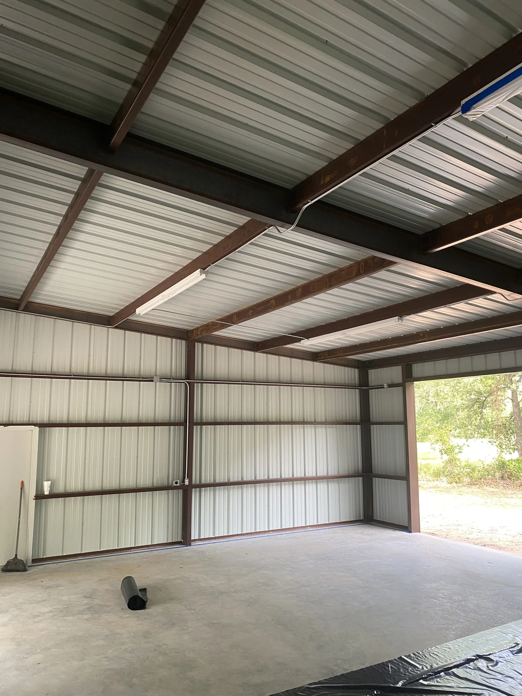 Granbury metal shop interior before closed-cell spray foam