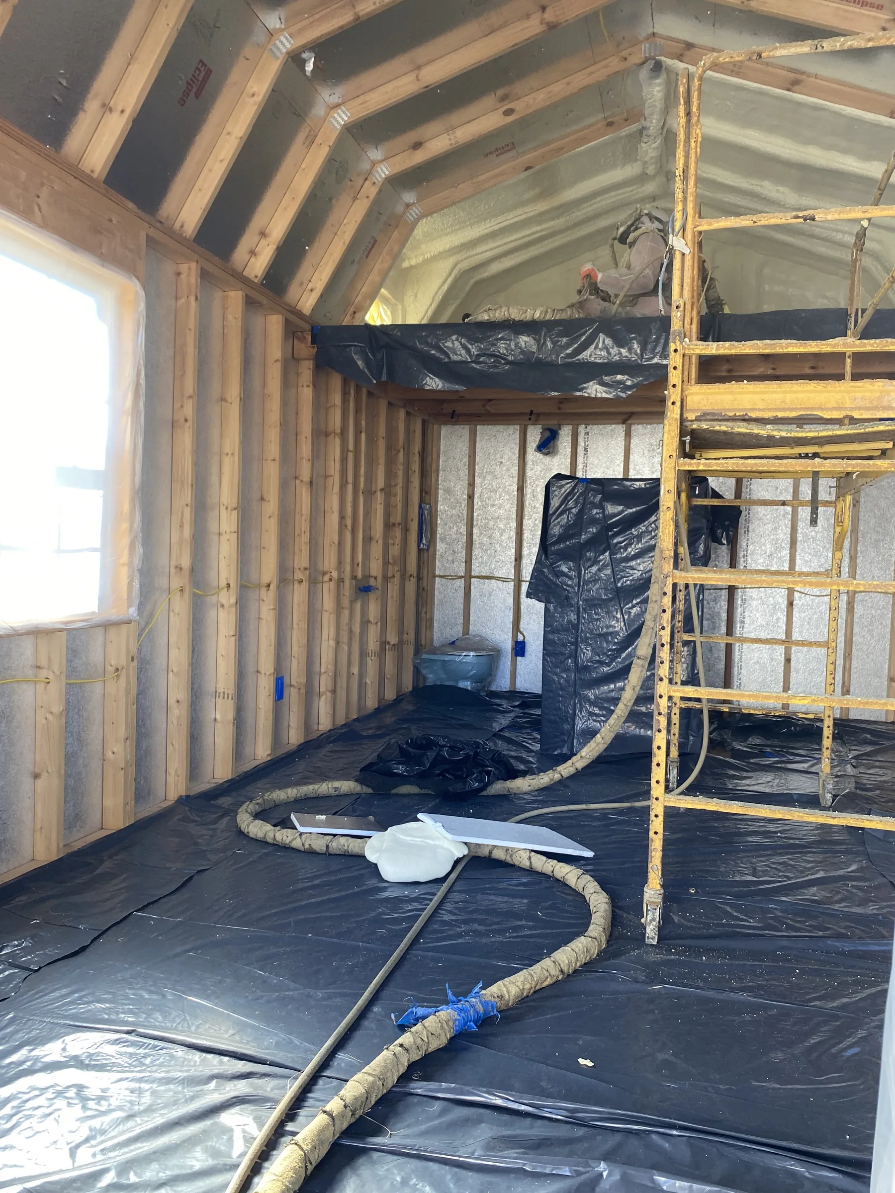 Hamilton ranch cabin after closed-cell spray foam before paint