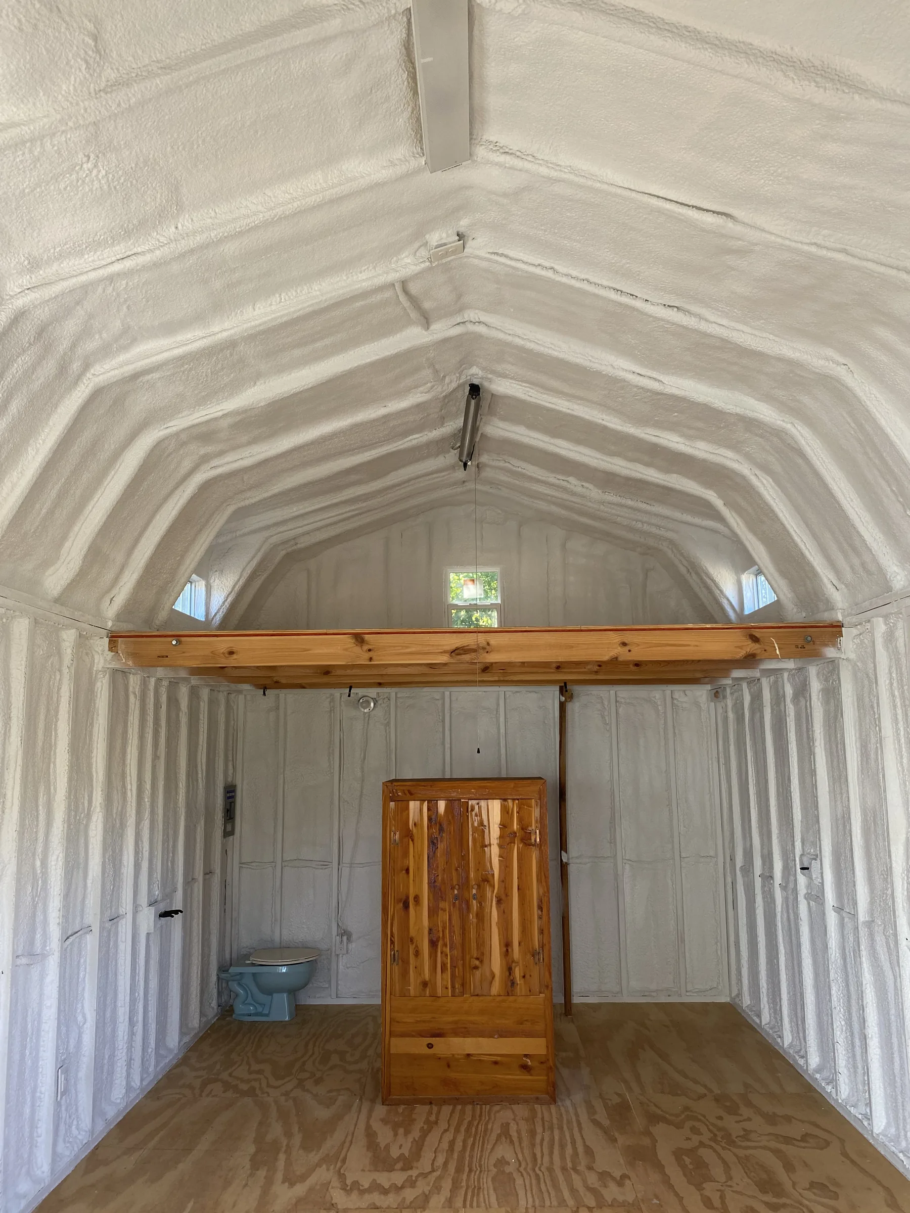 Hamilton ranch cabin with closed-cell spray foam and white paint