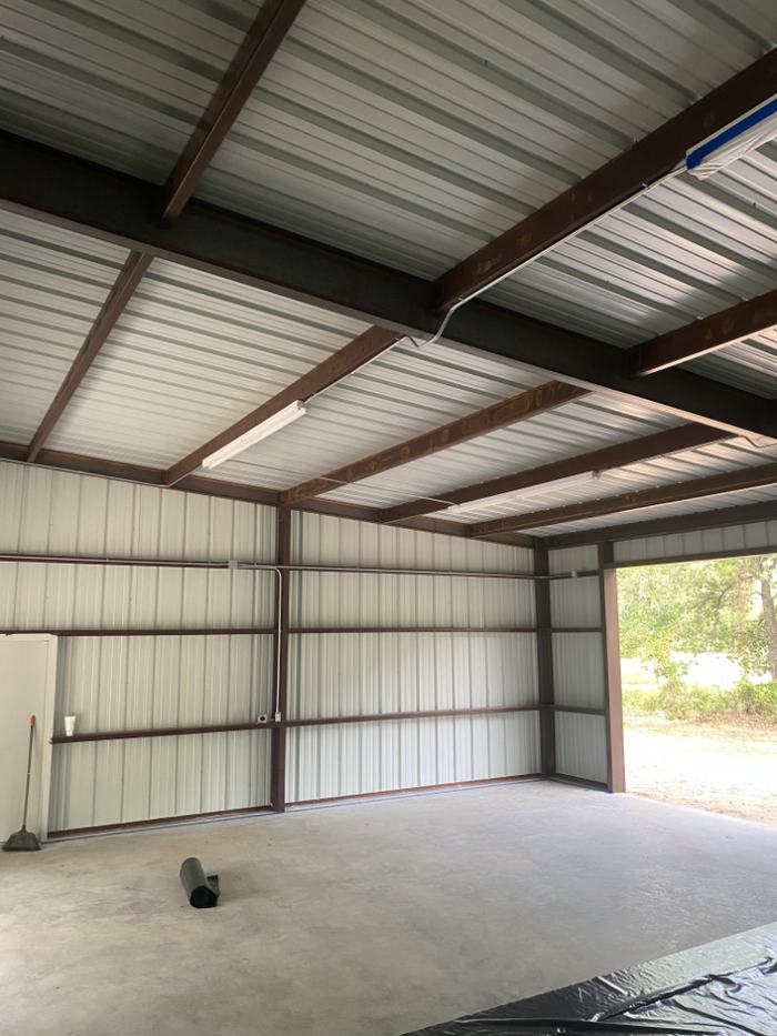 Bare metal shop interior in Granbury, TX before spray foam insulation